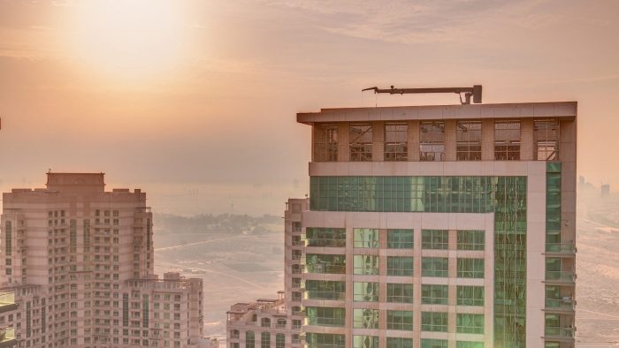 Sunrise,Over,Towers,In,Greens,District,Aerial,View,From,Top